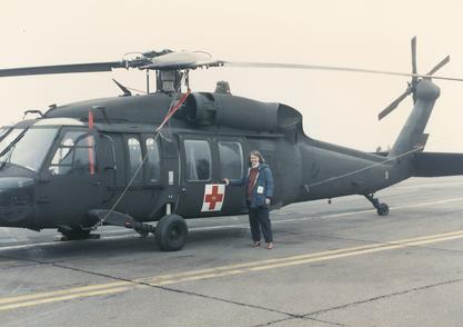 Susan Briggs helping to evacuate children following an earthquake in Armenia, 1989