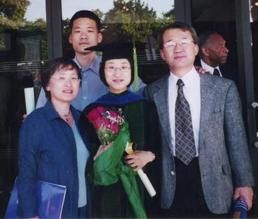 Ina Rhee with her family at her graduation from the Johns Hopkins University School of Medicine, 2002